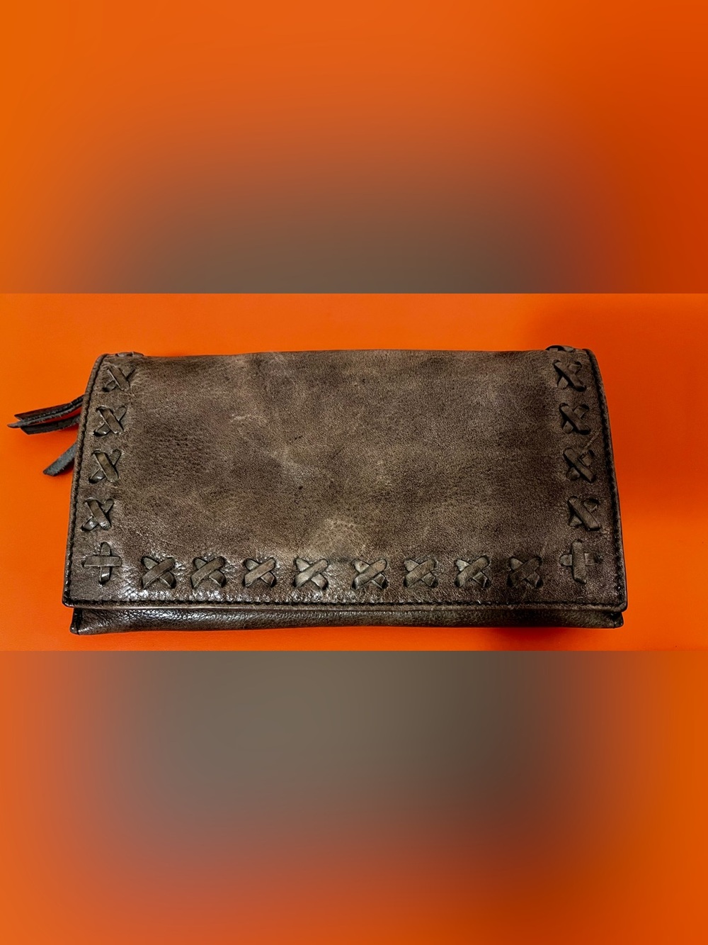 Latico distressed soft green leather crossbody/wallet with stitched design.